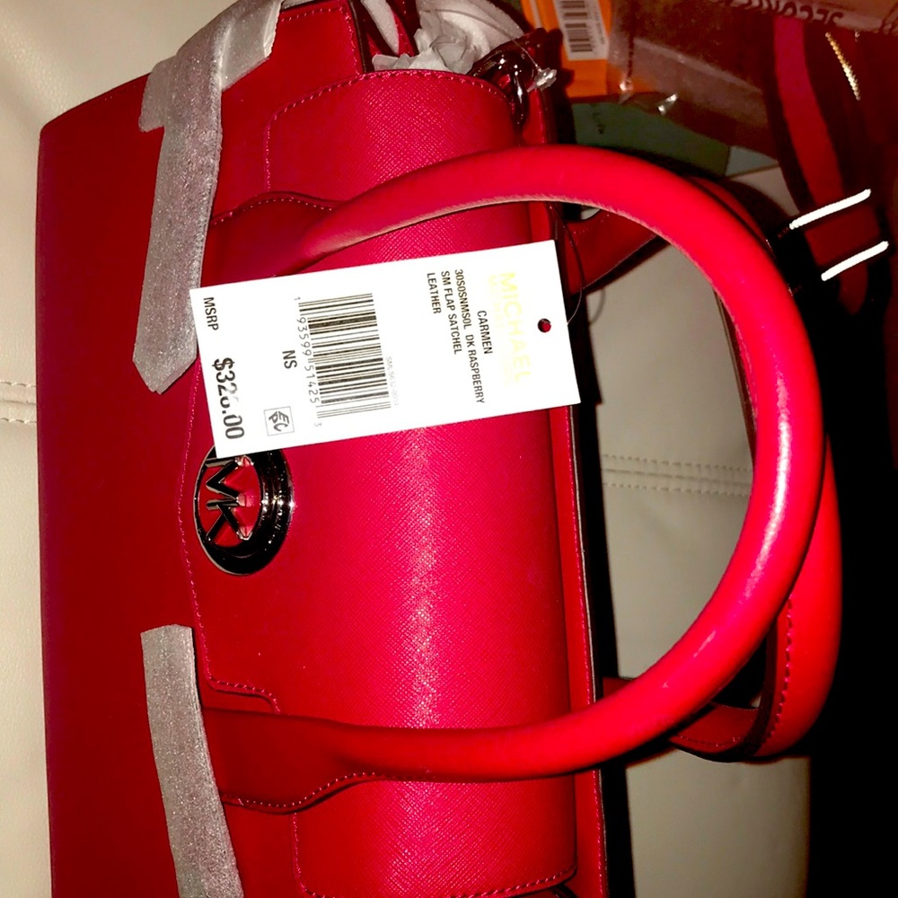 Michael Kors rich red satchel with two different types of straps